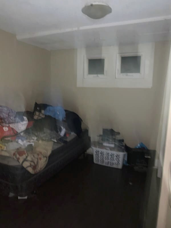 Cluttered living area before deep cleaning