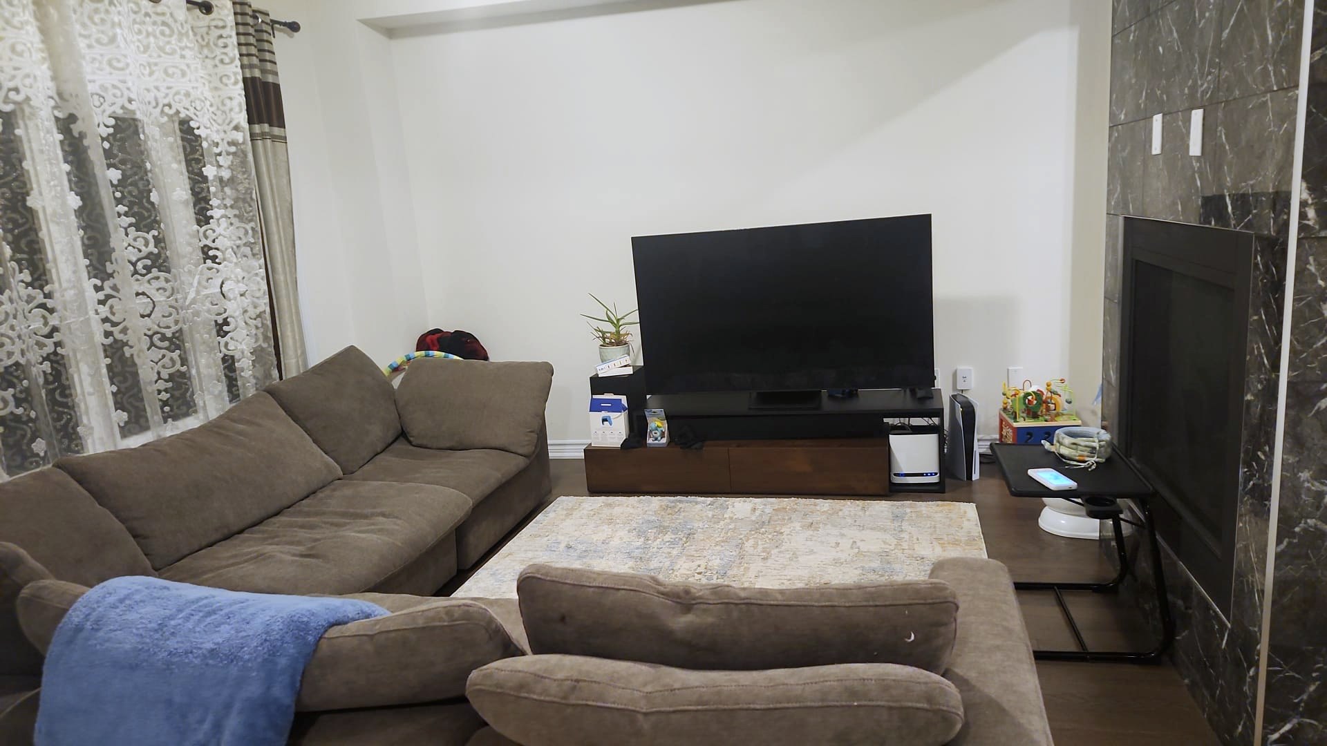 Tidy family room with sectional sofa and clean floors