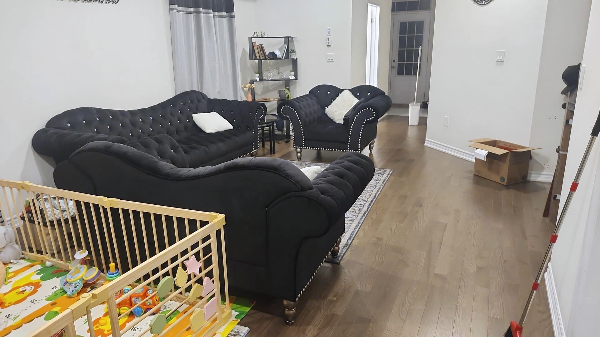 Clean family room with play area and polished floors